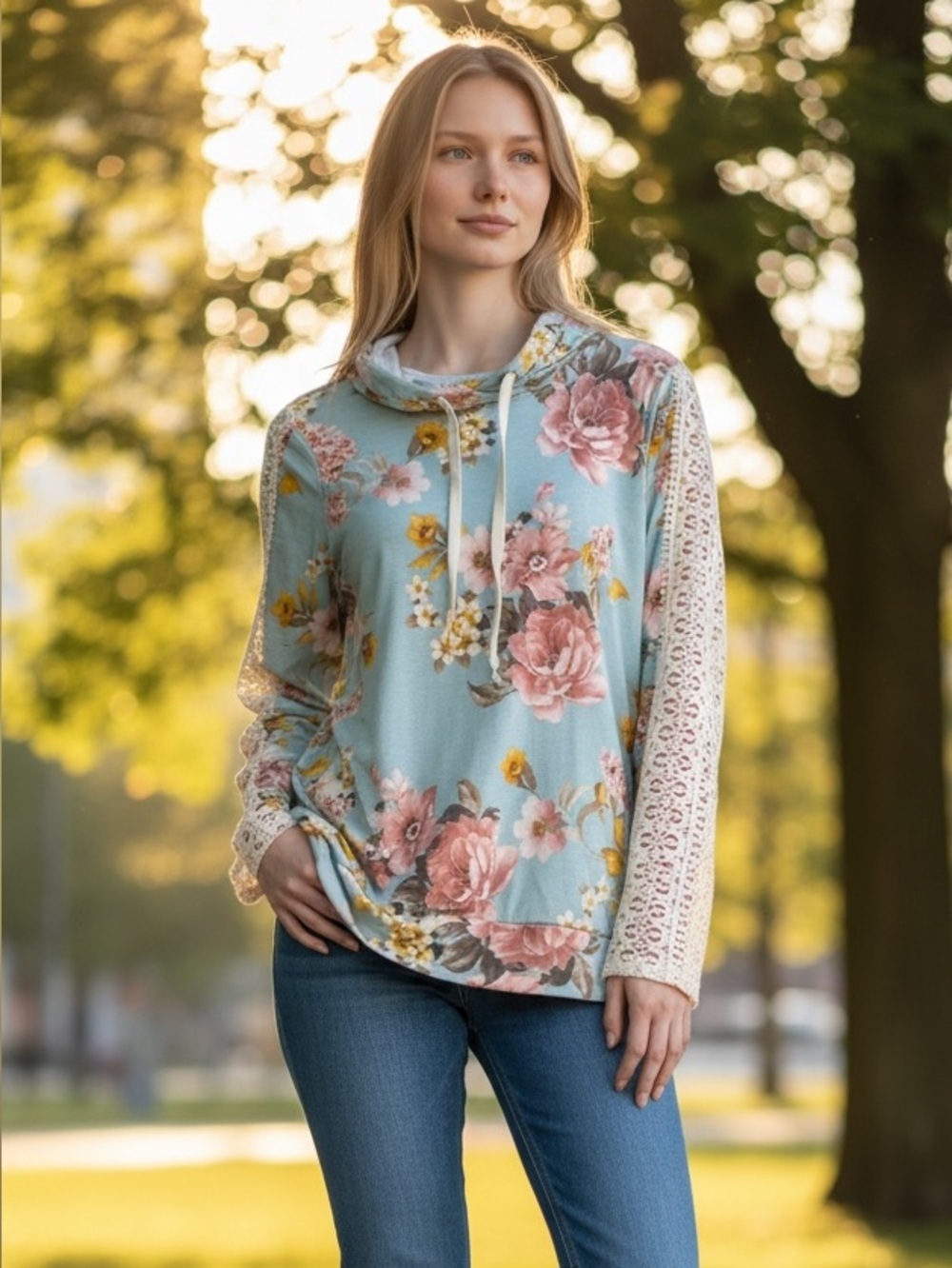 NWOT! Very beautiful flowered, long sleeve shirt with lace on the sleeves.